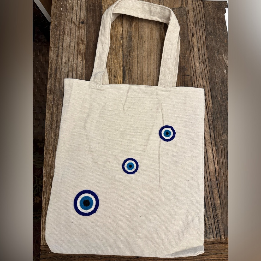 Brand new evil eye canvas tote bags.